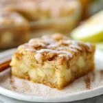 close-up hero shot of apple snickerdoodle bars with cinnamon sugar topping and diced apples