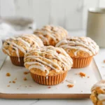 fresh cinnamon roll pumpkin muffins on a plate in natural light modern kitchen