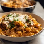 creamy beef pasta in modern kitchen with fresh garnish and creamy sauce