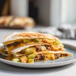 photorealistic cheeseburger quesadilla on plate with melted cheese and golden tortilla in modern kitchen
