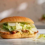 Chicken Caesar Sandwich plated on modern countertop in bright natural light