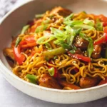 Chicken Ramen Stir Fry - bright natural lighting showcasing a plated stir fry with chicken, ramen noodles, and garnish