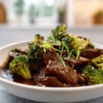 finished crockpot beef and broccoli plated in a modern kitchen