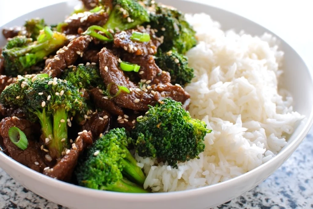 plated serving of crockpot beef and broccoli with jasmine rice