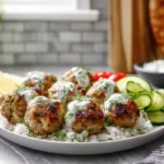plated Greek Turkey Meatballs with Tzatziki in a modern kitchen
