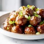 photorealistic honey garlic meatballs hero shot in modern kitchen