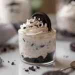 Photorealistic no bake cheesecake cups oreo treats layered in a glass cup