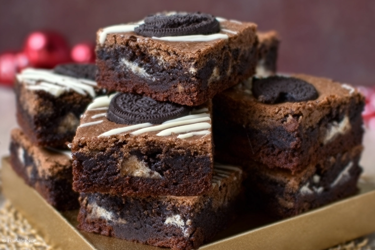 photorealistic hero image of slutty brownies cookie dough stacked on a plate