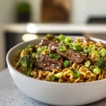 Photorealistic bowl of Beef and Broccoli Ramen Stir Fry in modern kitchen