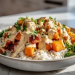 chicken sweet potato bowls with roasted sweet potatoes, chicken, rice, and creamy sauce