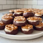 Cookie Dough Pretzel Bites plated with chocolate coating in a bright home kitchen