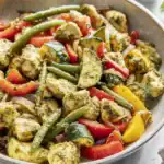 Pesto Chicken and Vegetables served warm with basil pesto and sautéed vegetables