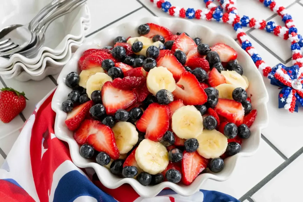 4th of July Fruit Salad With Honey Lime Dressing 16 Close-up of 4th of July fruit salad with strawberries blueberries and bananas