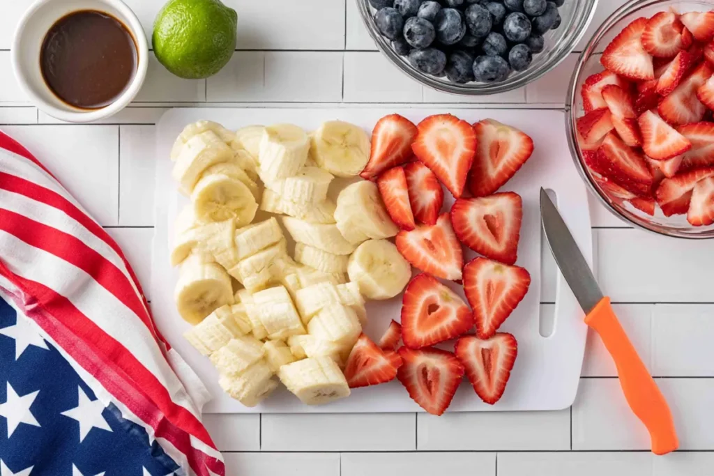 4th of July Fruit Salad With Honey Lime Dressing 11 4th of July fruit salad fruit prep with sliced strawberries and banana chunks