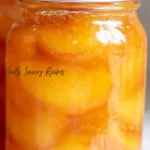 Honey Syrup Canned Peaches recipe with golden peach slices preserved in glass jars