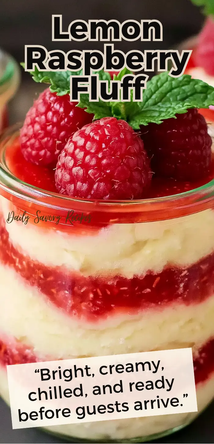 Lemon Raspberry Fluff recipe served in jars with lemon cream, smashed raspberries, and mint garnish
