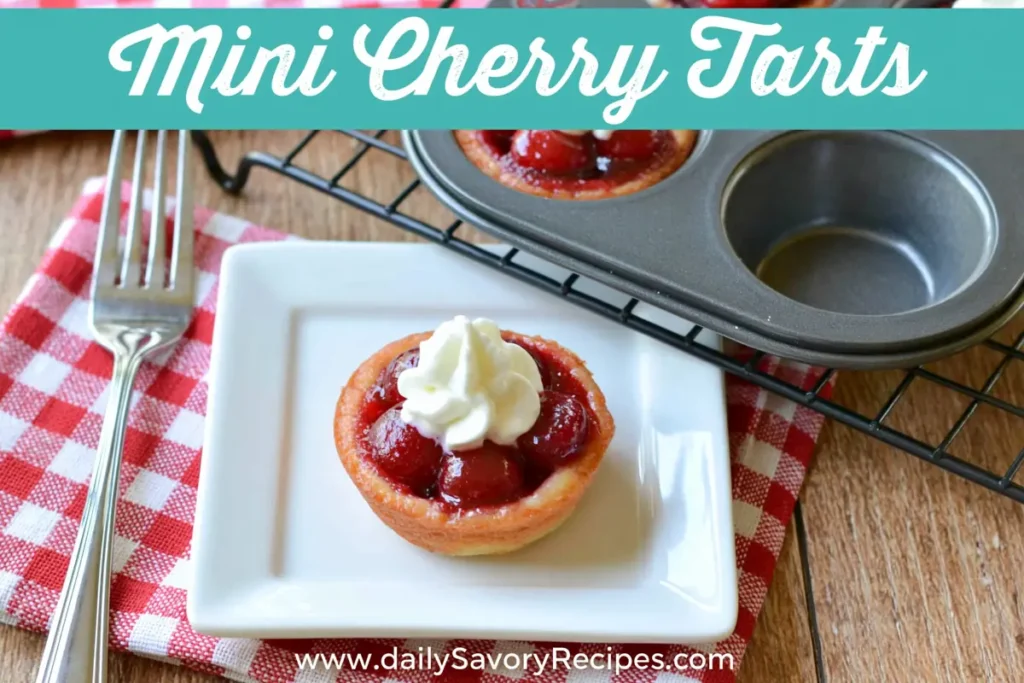 Mini Cherry Tarts with Cream Cheese Crust (Easy Homemade Version) 11 Baked Mini Cherry Tarts cooling with golden crusts and glossy cherry filling