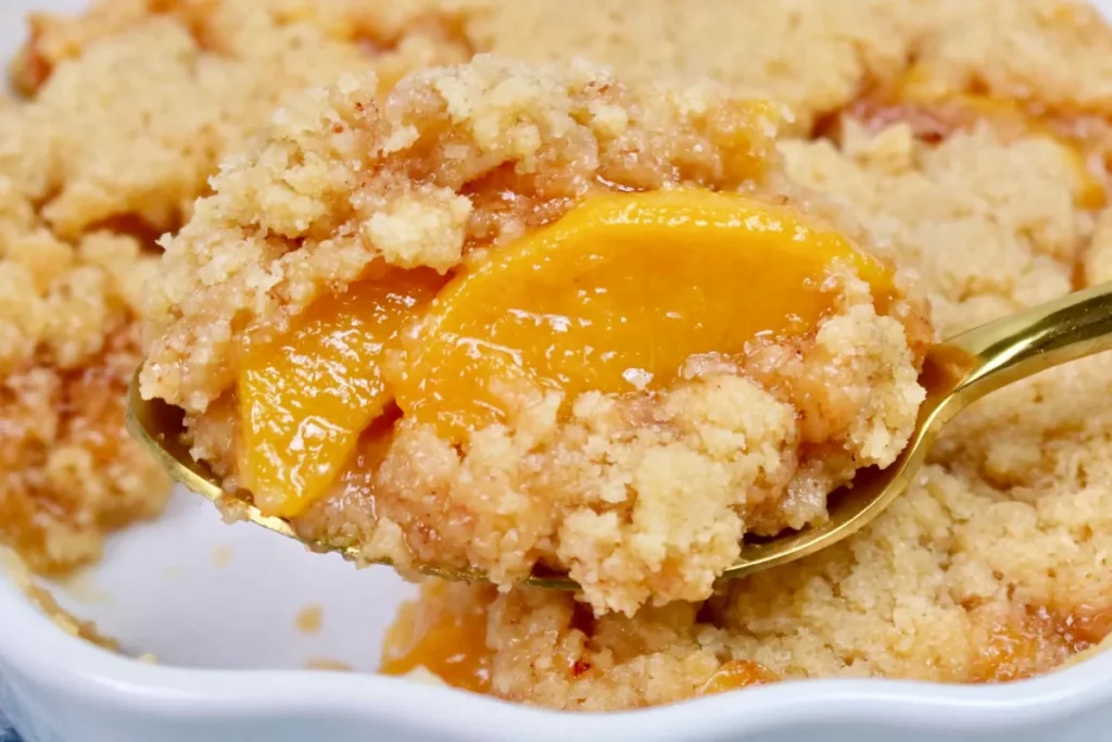 Best Peach Cobbler with golden cookie-style topping and juicy baked peaches