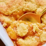Chef Taha Ayad's Recipe Best Peach Cobbler with golden cookie-style topping