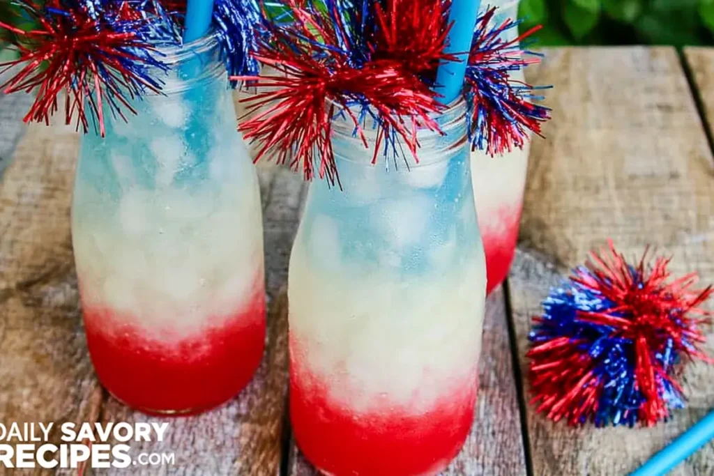 Non-Alcoholic Layered Drinks for Summer Parties 8 Non-alcoholic layered drinks served in clear glass bottles with patriotic straws