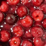 Chef Taha Ayad's Recipe Frozen Cherry Pie Filling with glossy cherries in a saucepan