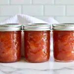 Chef Taha Ayad's Recipe Nectarine Jam with jars of homemade preserve and fresh nectarines