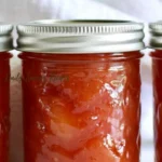 Nectarine Jam recipe pin with jars of homemade jam and chopped fresh nectarines