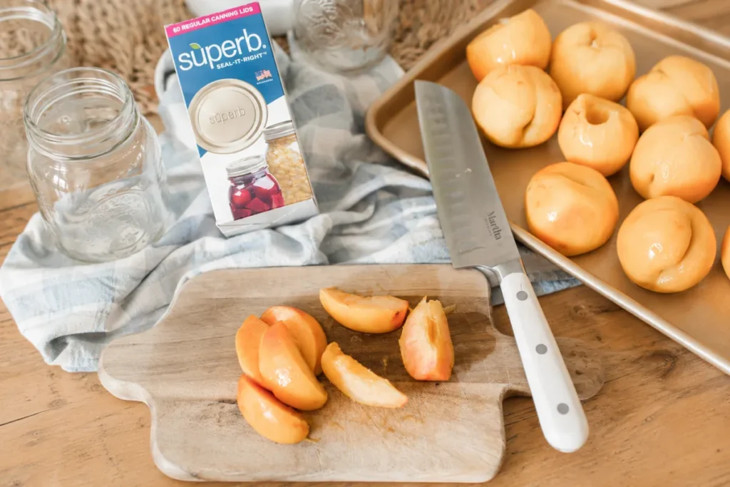 Honey Syrup Canned Peaches (A Simple Water Bath Method) 8 Honey Syrup Canned Peaches prep with peeled peaches canning jars and lids