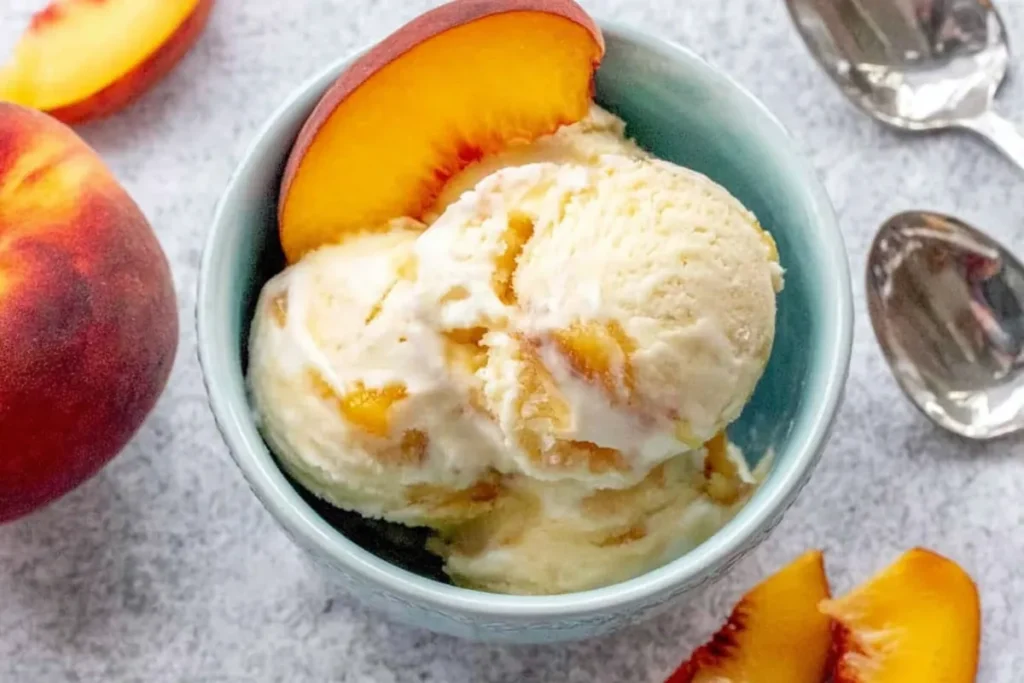 Peach Ice Cream with Fresh Summer Peaches and Classic Custard Base 19 Peach Ice Cream Bowl with Fresh Peaches and Serving Spoons