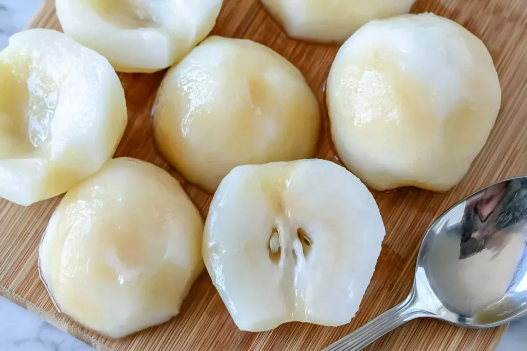 Peeled pear halves prepared for Baked Pears with honey cinnamon sauce