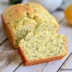 Chef Taha Ayad's Recipe Lemon Poppy Seed Zucchini Bread with sliced loaf and lemon