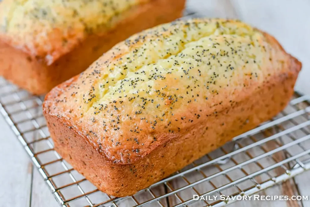 Lemon Poppy Seed Zucchini Bread loaves cooling on a wire rack