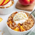 Chef Taha Ayad's Recipe Peach Crisp for Two served warm with vanilla ice cream