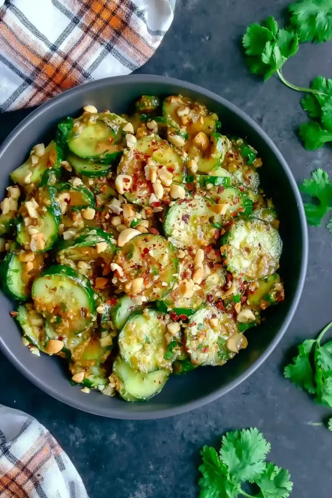 Spicy Peanut Cucumber Salad with Crunchy Peanuts and Fresh Herbs 6 Spicy Peanut Cucumber Salad with crisp drained cucumbers and creamy peanut dressing