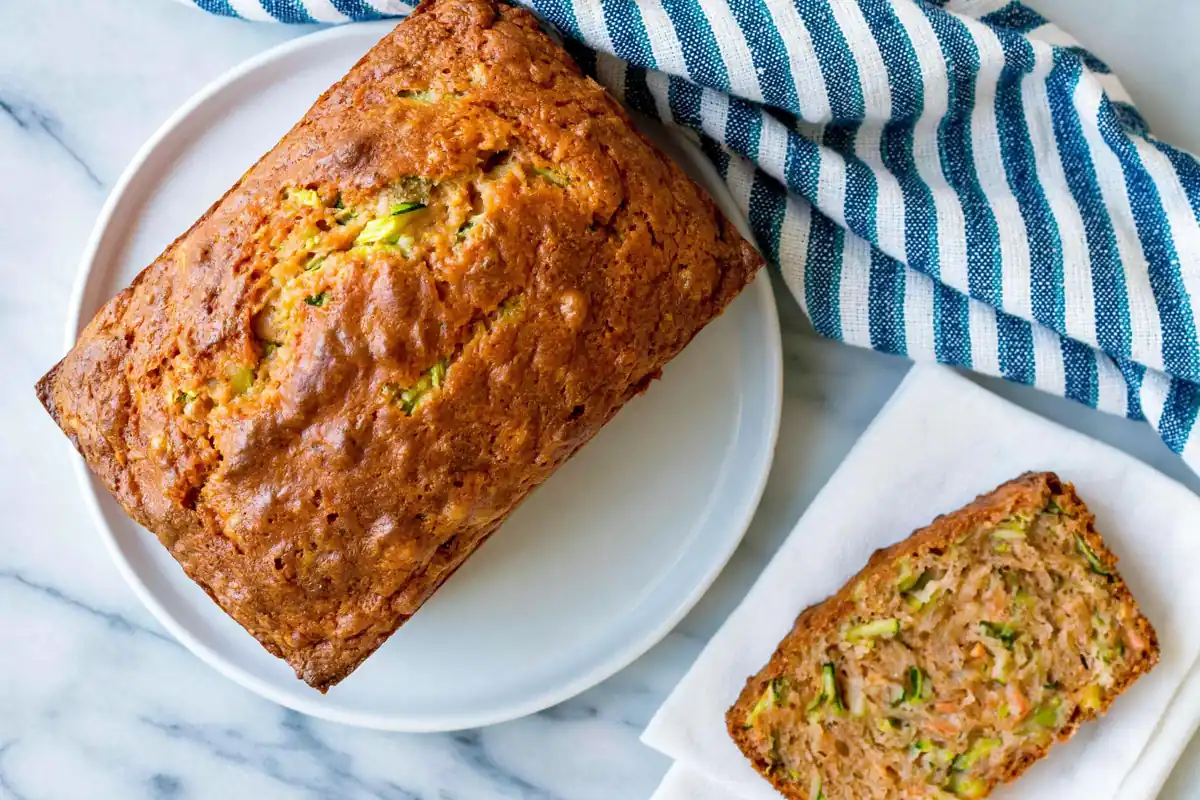 Vegan Zucchini Bread with Warm Spices and a Tender Crumb 31 Chef Taha Ayad's Recipe Vegan Zucchini Bread with a golden loaf and tender sliced crumb