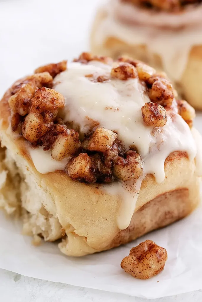Close-up of an Apple Cinnamon Roll showing tender dough and cinnamon-spiced apple filling