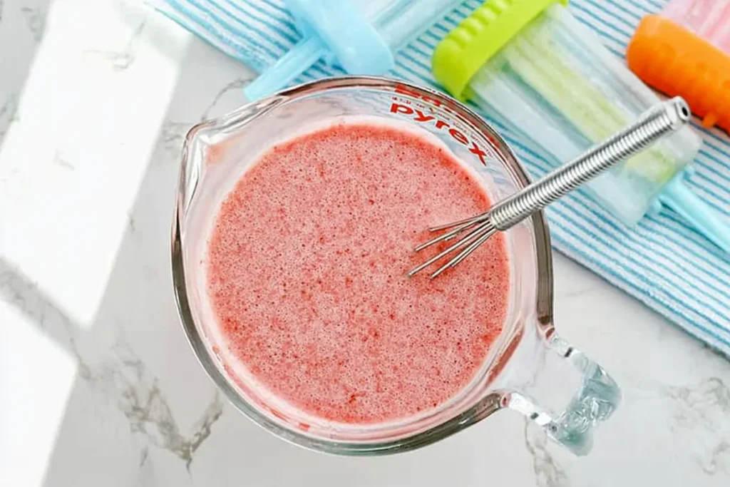 Easy Jell-O Popsicles That Hold Their Shape Longer 11 Dissolved red mixture for smooth and firm Jell-O Popsicles