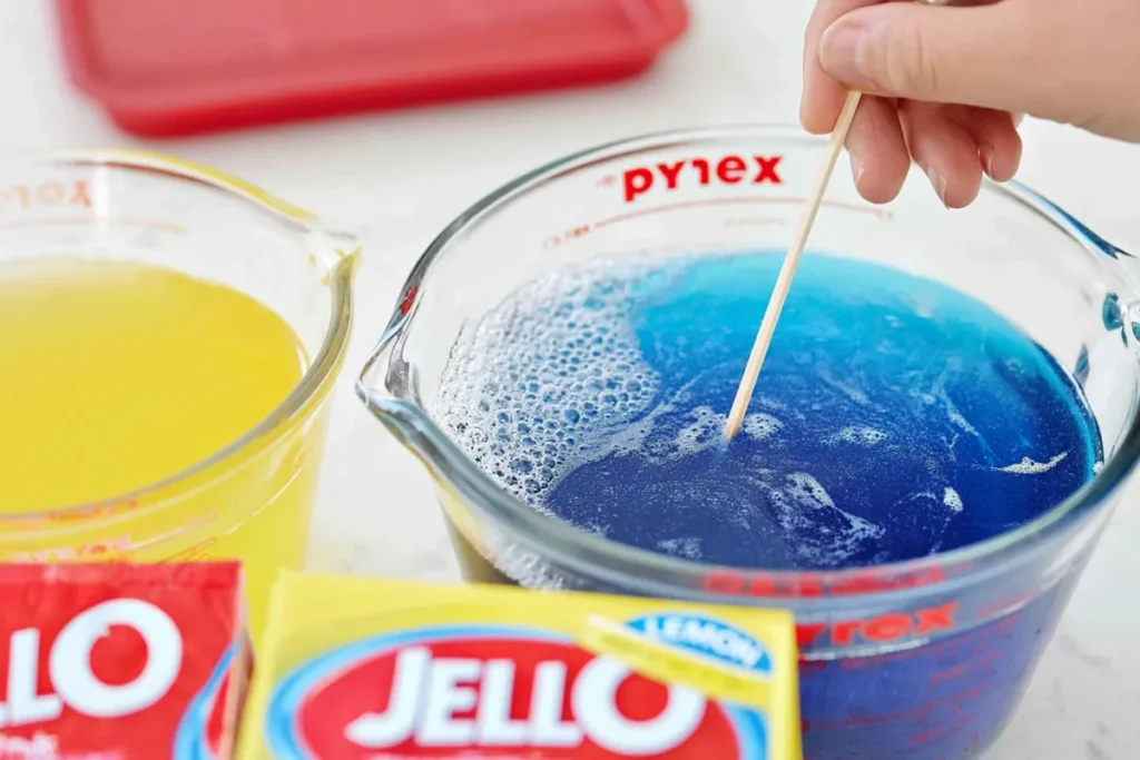 Jello Jigglers: A Firm, Colorful Finger Snack for Parties 4 Blue Jello Jigglers gelatin fully dissolved in a glass measuring cup