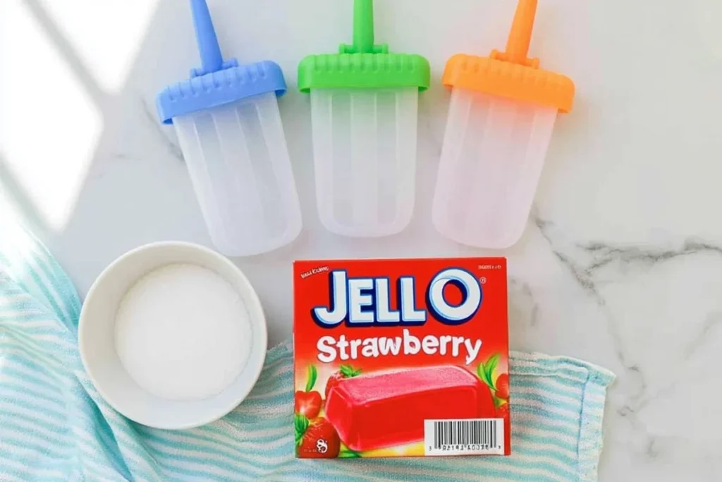 Easy Jell-O Popsicles That Hold Their Shape Longer 9 Jell-O Popsicles ingredients with gelatin, sugar, and colorful reusable molds