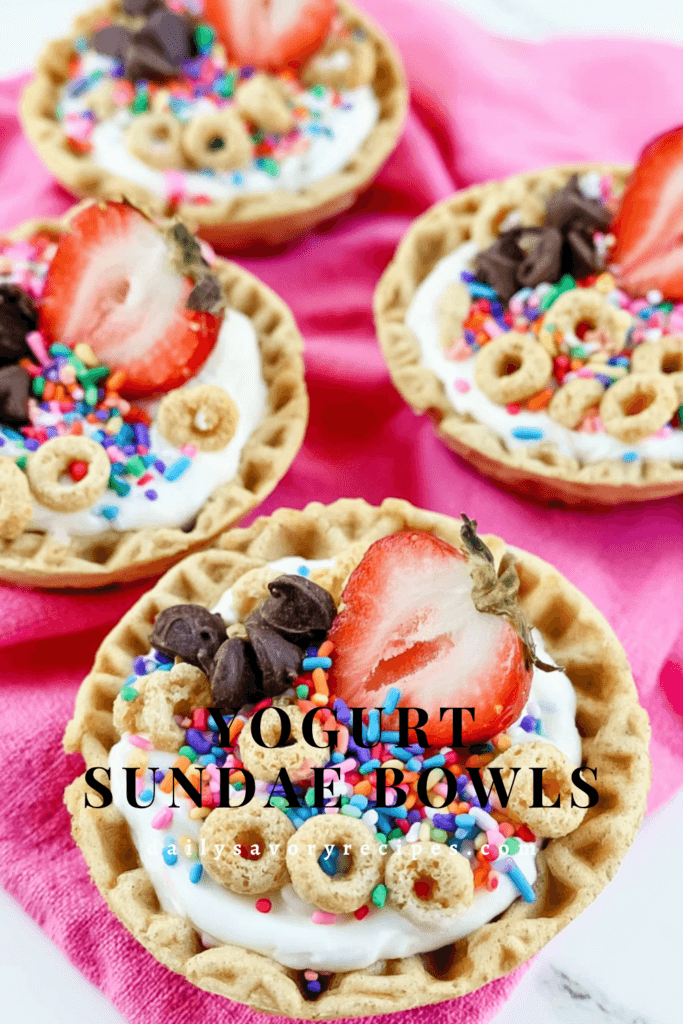 Yogurt Sundae Bowls with Strawberries and Crunchy Toppings 9 Yogurt Sundae Bowls recipe with strawberries, Cheerios, chocolate chips, and rainbow sprinkles